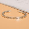 sterling silver bangle bracelet, minimalist design, customizable characters can be engraved.