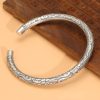 Sterling Silver Bangle Bracelet with Classic Clouds Cuff, this is a left side view image of the bangle bracelet.
