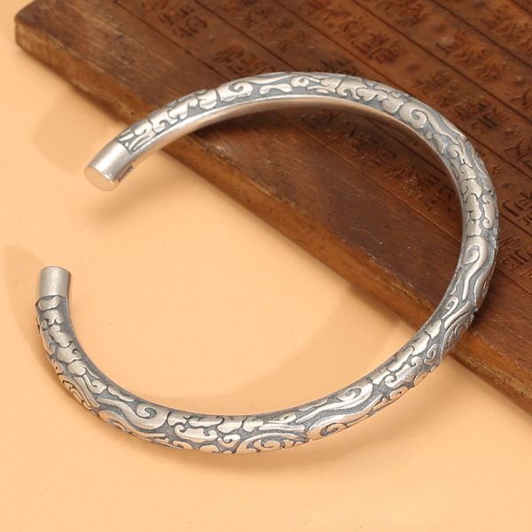 Sterling Silver Bangle Bracelet with Classic Clouds Cuff, this is a left side view image of the bangle bracelet.