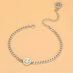 Pulsera con cadena tipo curb en plata de ley 925 con cara sonriente