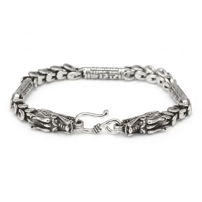 Bold 925 Thai silver bracelet featuring a majestic dragon head, symbol of power and strength.