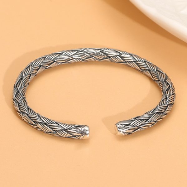 sterling silver charm bracelet vintage, the bracelet features intricate details woven from four strands of solid sterling silver wire.