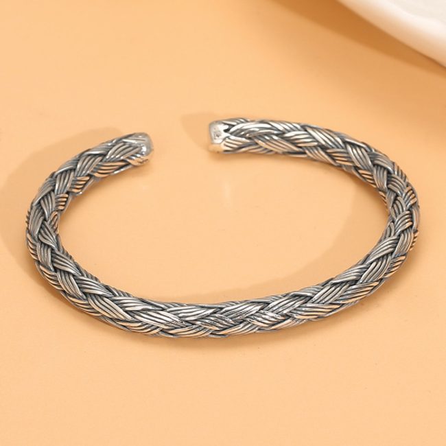 sterling silver charm bracelet vintage, front view of the silver bangle