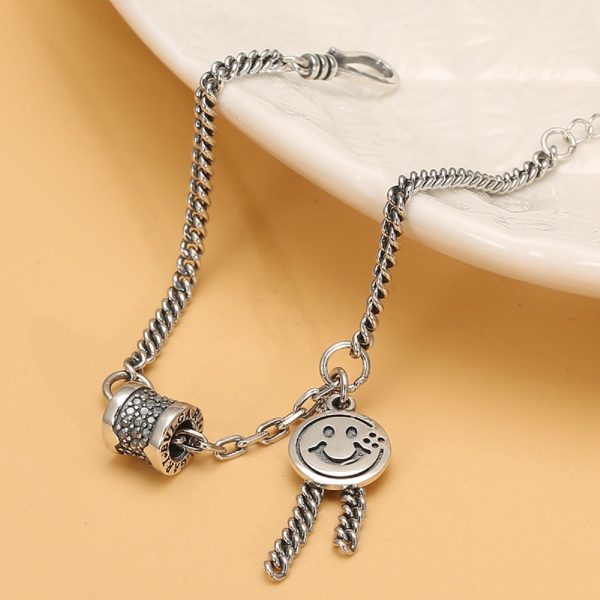 Tassel Chain sterling silver bracelet for women, with a round smiley face and silver tassel.