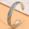 Sterling silver bangle bracelet, bracelet surface engraved with feathers
