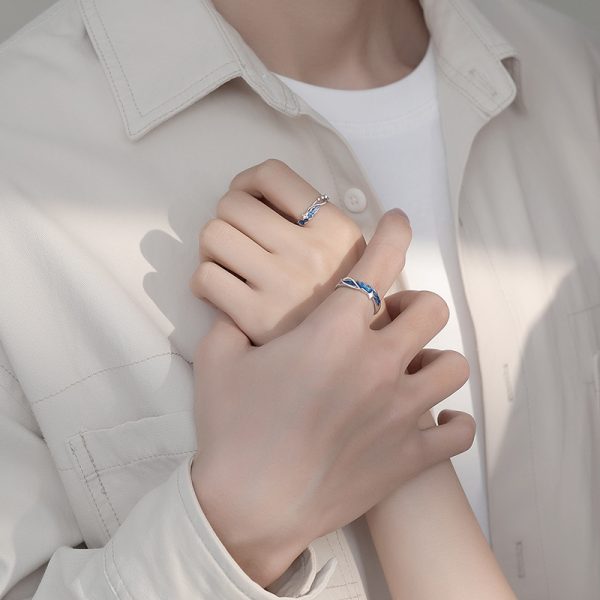 Silver couple Rings With Enamel, with a prominent star design on the ring, couple wears ring view