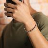 A man wear the silver bangles bracelets, very nice