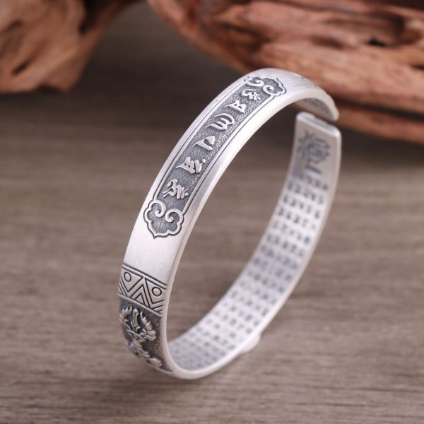 999 Sterling Silver Bangle with Buddhist Vajra, left detail view