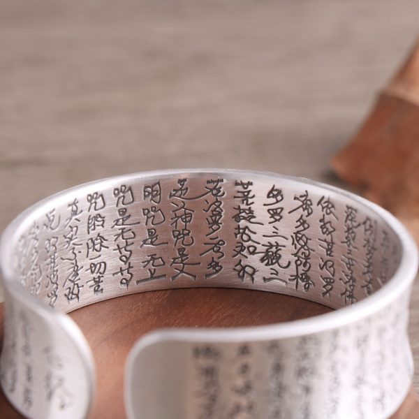 Heart Sutra Solid S999 Sterling Silver Bangles detail of character, The lotus heart sutra engraved on the inner side of the silver bangle , handcrafted with intricate lettering.