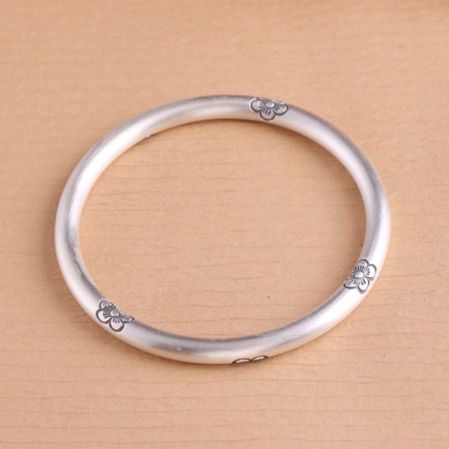 Sterling Silver Bangles of Carved Flowers detail view