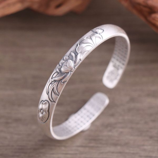 Sterling Silver Flower Engraved Bangle Bracelet, surface of the bracelet is engraved with a three-dimensional lotus flower.