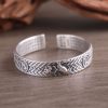 Woven Texture Sterling Silver Open Cuff Bangle, front view, Hand holding lotus carving detail