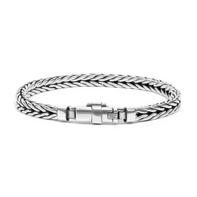 Detail view of a handmade 925 Thai silver braided bracelet with an antique distressed look.