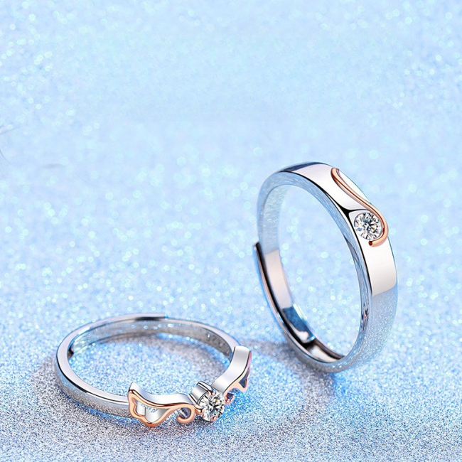 Engravable Angel Wings silver couples rings, detail view image, setting moissanite