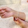 Sterling Silver Solid Round Bar Bangle Bracelet, women wear the bangle view image