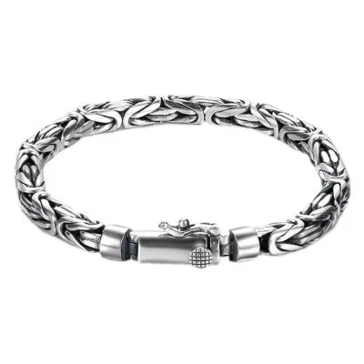 Artisanal 925 silver bracelet for men featuring an engraved peace pattern and vintage texture.