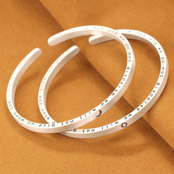 Solid 999 Sterling Silver Frosted Bangles With Moon and Sun, left view