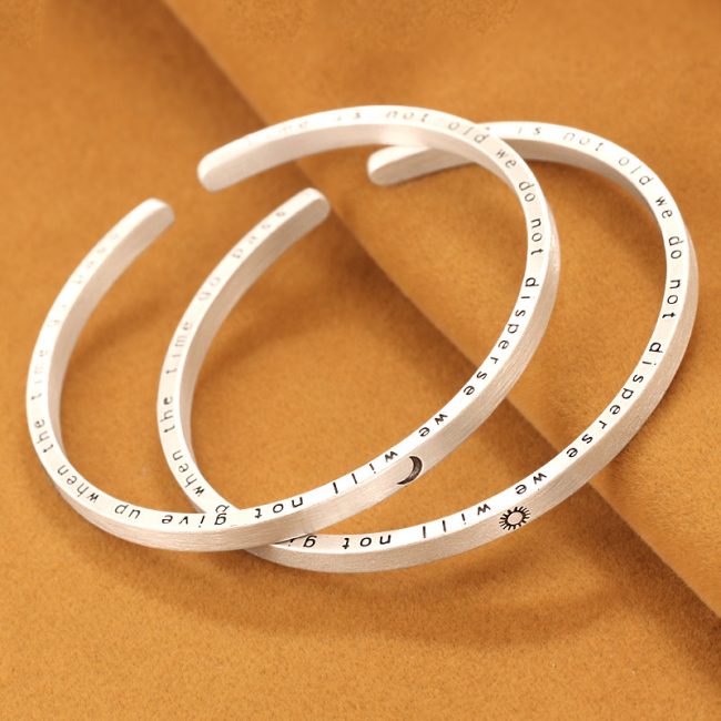 Solid 999 Sterling Silver Frosted Bangles With Moon and Sun, left view
