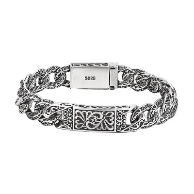 Detailed relief carving on a vintage Thai silver bracelet for men, showing cultural craftsmanship.