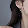 Pendientes largos con borlas y corazones de plata de ley