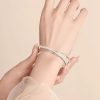 Pulsera doble de trébol de cuatro hojas y bambú
