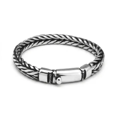 Man wearing a handmade 925 silver rope braid bracelet, showing the vintage Thai silver texture.