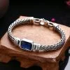 Pulsera de plata de ley 925 con circonita azul.