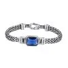 Handcrafted 925 sterling silver men's bracelet featuring a central blue zircon gemstone and antique finish.