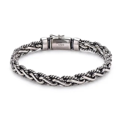 Detailed view of a thick braided chain bracelet for men made of solid 925 sterling silver.
