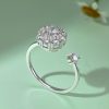Anillo de plata de ley 925 con forma de flor giratoria, circonita cúbica de alta calidad y banda ajustable, para mujer.