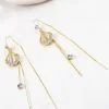 925 sterling silver threader earrings with a ginkgo leaf opal centerpiece and cubic zirconia accents.