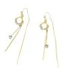 Close-up of the shimmering cat's eye stone and dangling crystal detail on a silver tassel earring.
