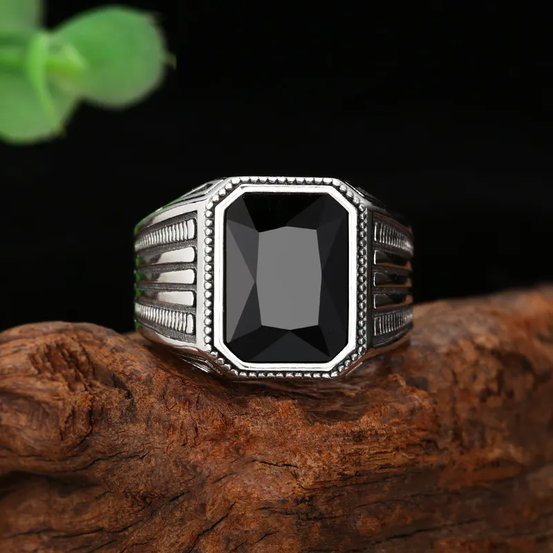 Modern men's silver signet ring with black stone